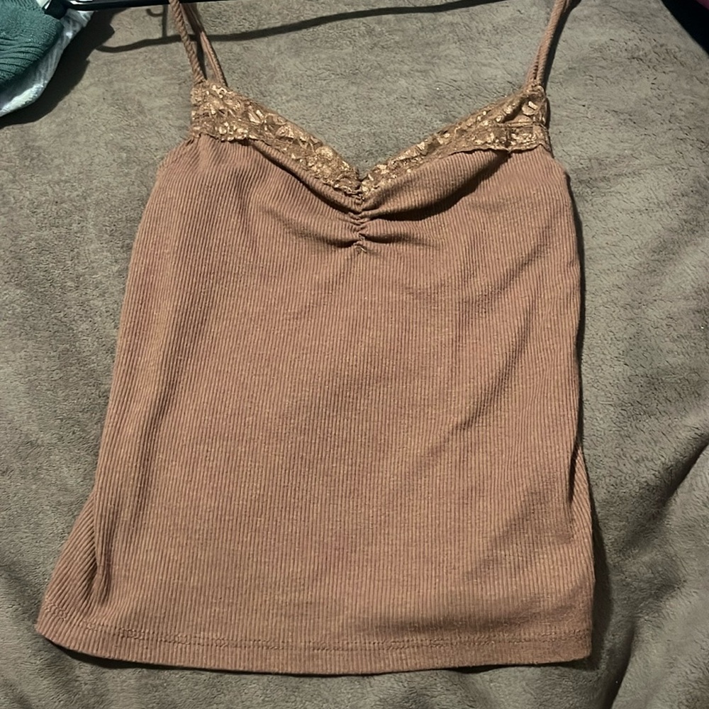 Brown mid-length shirt with lace at the top, size small but fits like a medium.